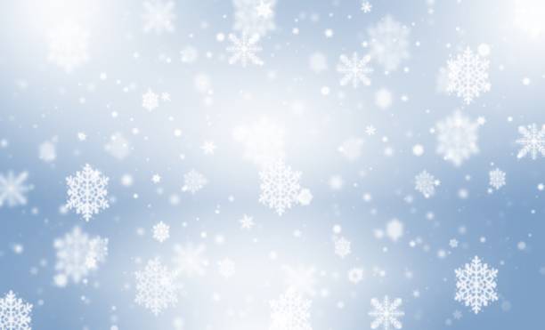 istock Blue abstract background. white bokeh snowflakes blurred beautiful shiny lights. use for Merry Christmas, happy new year wallpaper backdrop and your product. 1355429033
