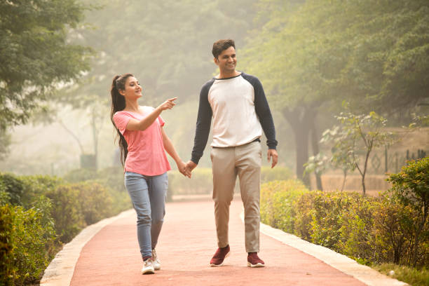 Couple having fun while admiring view at park