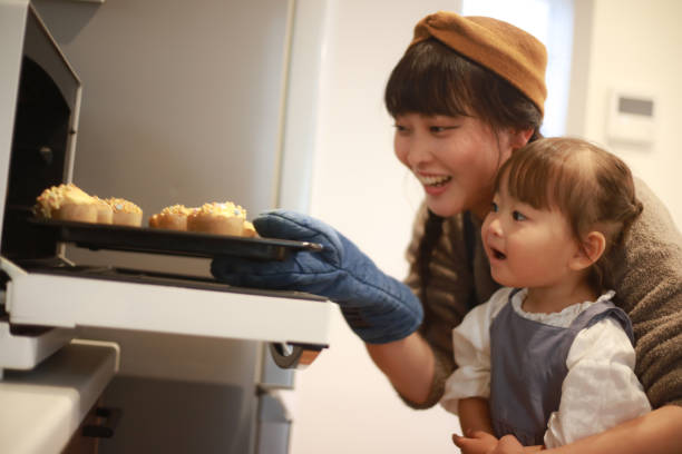 istock Parents and children making sweets 1355429988