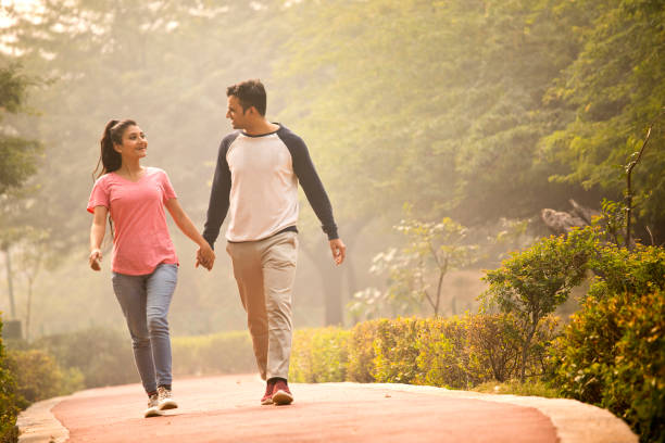 Young couple walking at park