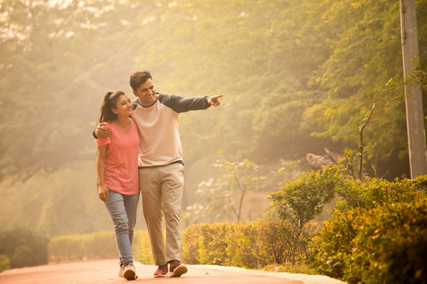 Couple having fun while admiring view at park