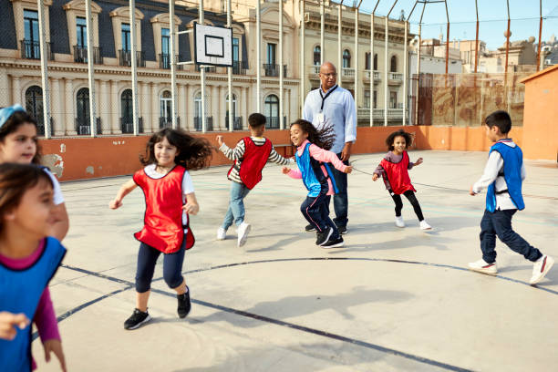 istock Elementary Age Boys and Girls Playing Outdoors 1355430850