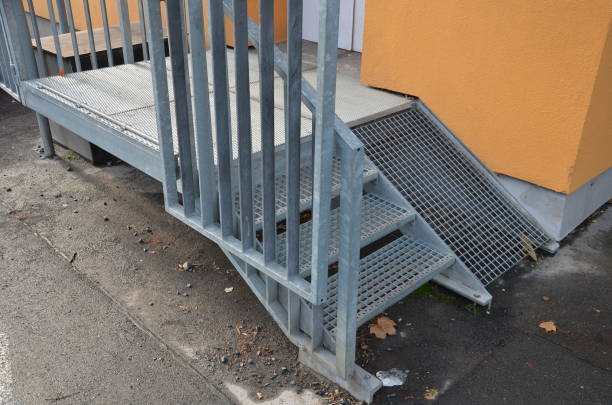 istock loading ramp at a restaurant or shop. galvanized staircase with railings and ramp with a lattice anti-slip ramp for the import of goods and food, or entry of immobile persons in wheelchairs 1355430997