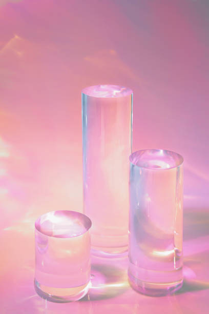 istock three clear glass cylinder podiums on pastel pink background 1355431010