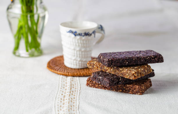 istock Close up macro of various healthy granola bars on the table (muesli or cereal bar) creative stock image 1355431199