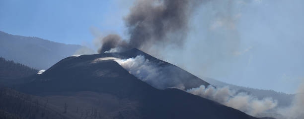 istock Active volcano releasing ash and gases 1355431242