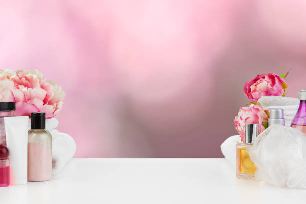 istock Towels with flowers on light table against blurred background 1355433261