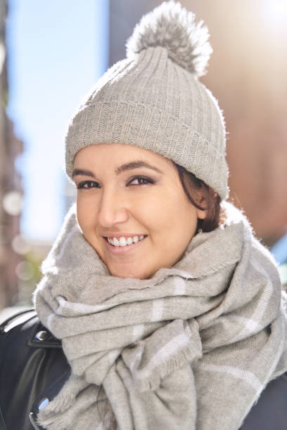 istock Merry young female in knitted hat 1355434447