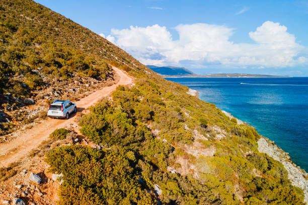 istock suv car at trail road sea vacation 1355434452