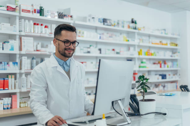 istock Portrait of a handsome pharmacist working in a pharmacy 1355434702