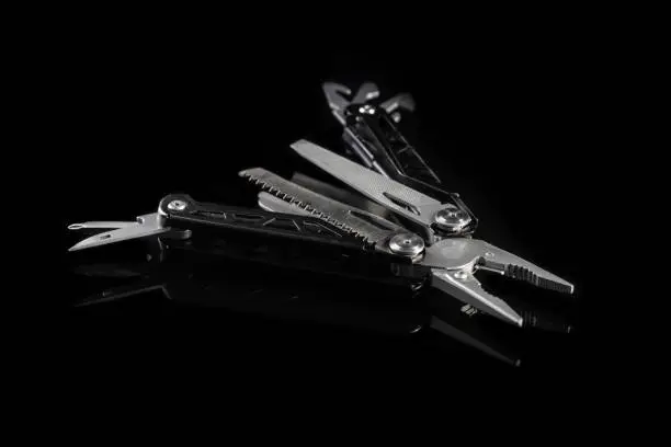 Multi-tools pliers with other tools and knife. Multifunction pliers.