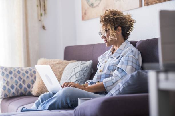 istock Woman Sitting On Sofa At Home 1355438452