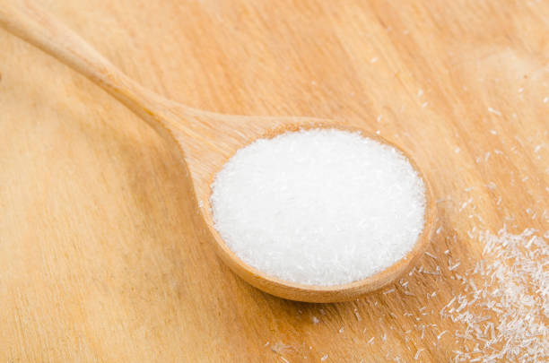 istock Monosodium glutamate in wooden spoon. 1355440124