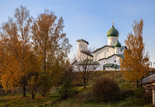 Ancient Church of the Epiphany from Zapskovye in an autumn park, Pskov, Russia