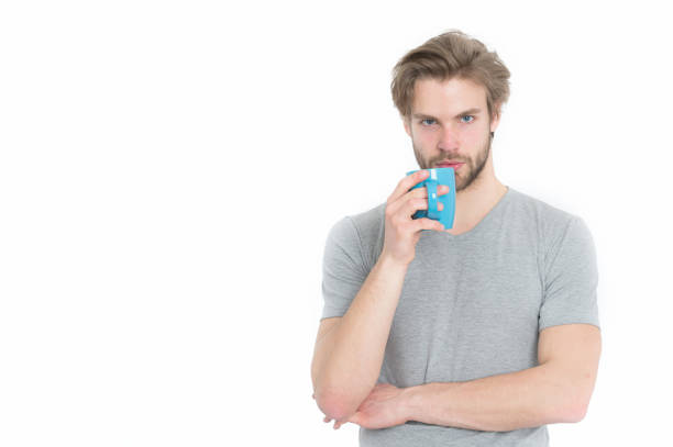 istock serious man with tea or coffee cop in morning 1355444071