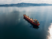 istock Aerial View Cargo Ship Waiting to Enter the Port 1355444486