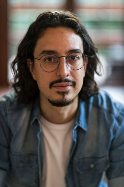 istock Portrait of man from inside the house 1355445447