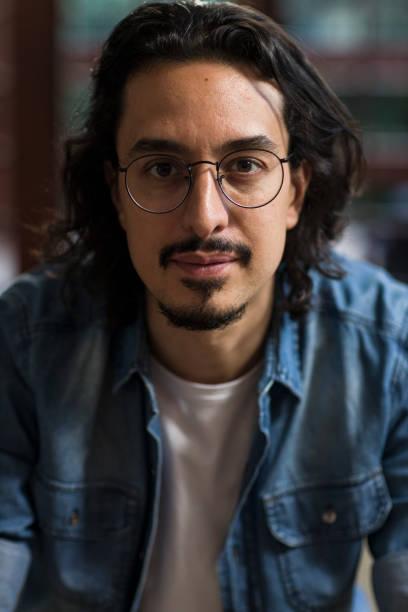 istock Portrait of man from inside the house 1355445455