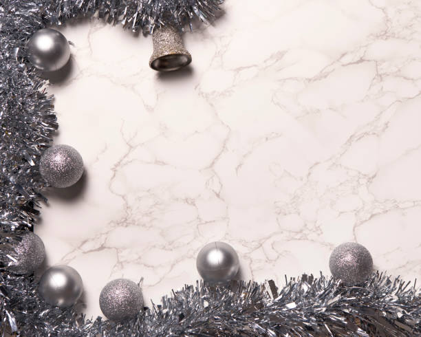 istock silver christmas decoration on marble background 1355448116