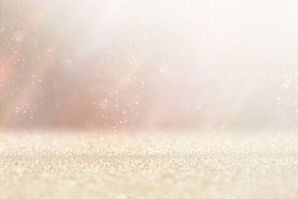 istock background of abstract gold and silver glitter lights. defocused 1355448181