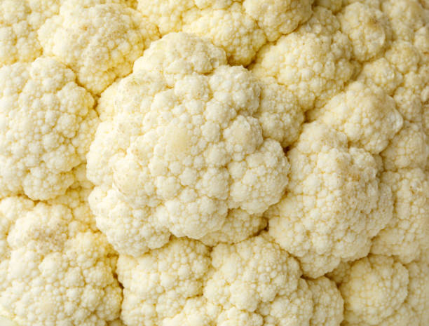 istock Close up of fresh cauliflower. Whole background. 1355448807
