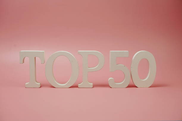 istock Top 50 word alphabet letters on pink background 1355454880