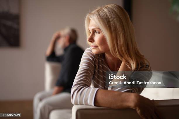 The Older Couple Has A Conflict Upset Mature Woman Quarrel With Her Husband Relationship Crisis Stock Photo - Download Image Now