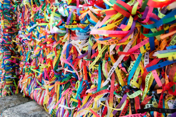 istock Thousands of colored ribbons tied to a gate. 1355460723