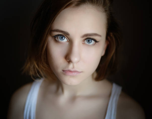 istock Young woman with blue eyes. 1355464055