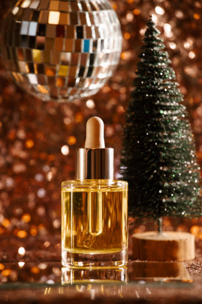 istock face oil on sequin background with disco ball and tree 1355465410