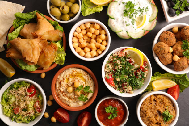 istock assorted of lebanese food (hummus, tabbouleh, sauce, falafel) 1355466635