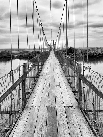Hanging bridge over the Barra Velha lagoon on the coast of the state of Santa Catarina in south of Brazil