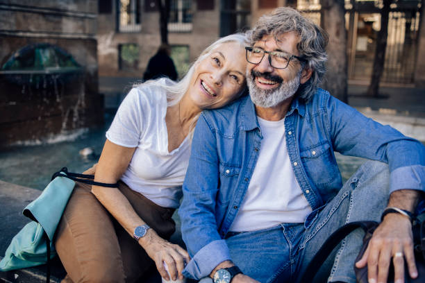 istock Mature couple on vacation taking a break while sightseeing 1355468219
