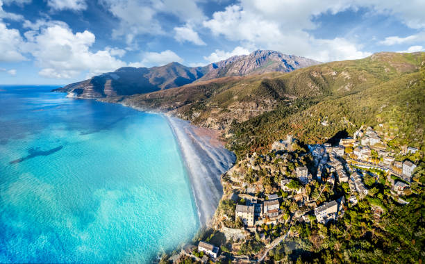 Aerial view with Nonza village , Corsica Aerial view with Nonza village , Corsica island, France haute corse photos stock pictures, royalty-free photos & images