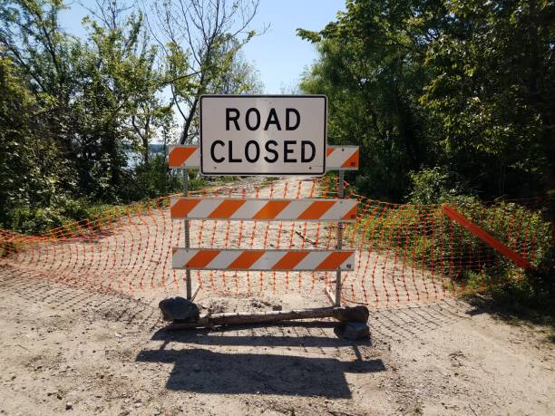 istock road closed sign on path or trail with trees outdoor 1355469411