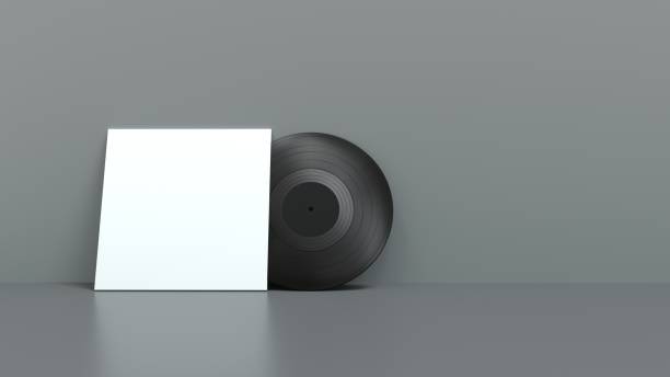 istock vinyl record in front of its cover placed against a wall 1355472674
