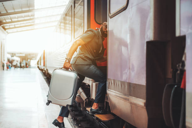 istock Black fancy guy entering the train 1355474857