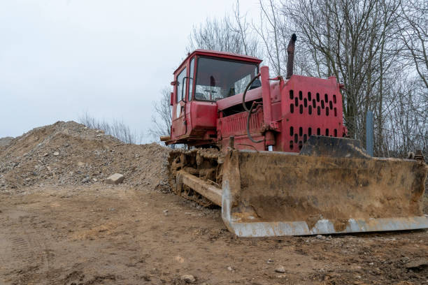 istock photograph of a very old Soviet bulldozer in working order at a construction site. 1355481260