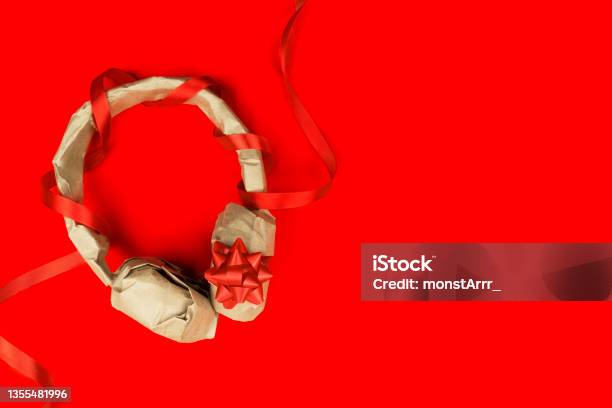 Headphones Wrapped In Craft Paper Stock Photo - Download Image Now - Christmas Music, Headphones, Christmas
