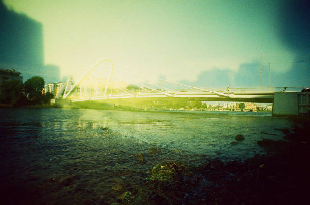 City morning landscape with a view of the bridge. Saint-Petersburg, Russia. Color film, multiple exposure.