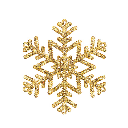 Golden toy snowflake isolated on a white background.