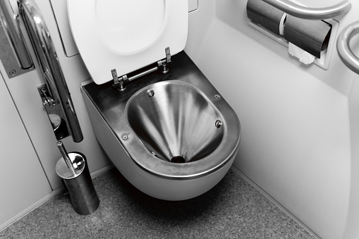 Sverdlovsk Oblast, Russia - November 05, 2021: vacuum toilet in a passenger train carriage