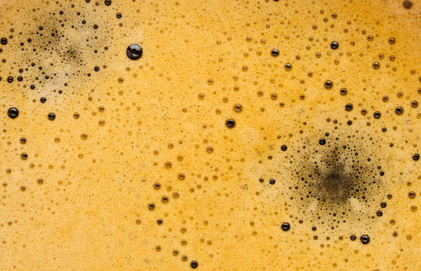 istock Horizontal background of espresso foam close up. Abstract, foamy texture, copy space 1355484815