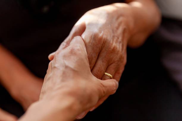 istock Girl holding mother's hand 1355485822
