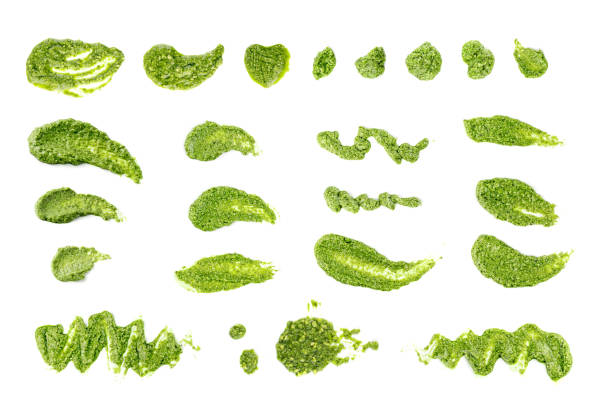 istock Pesto sauce spread or blob isolated on white background 1355486251