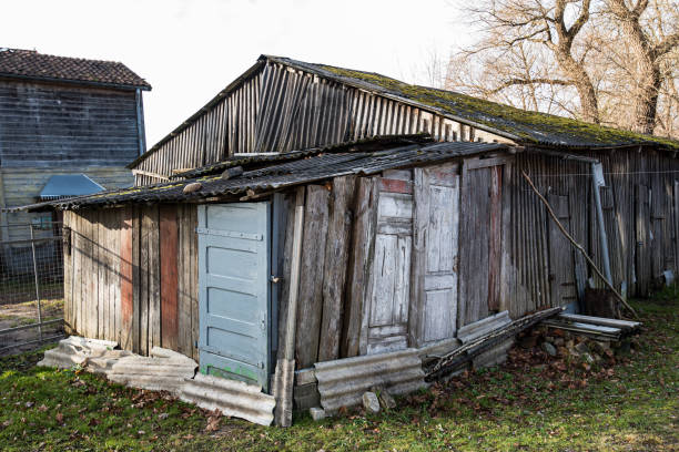 istock An old, sloping wooden shed with a sloping door. Kuldiga, Latvia 1355487564