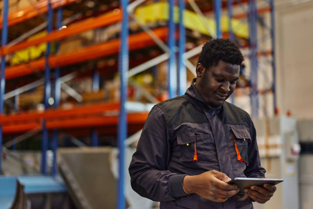 istock Busy african-american man, sending his boss an e-mail. 1355487710