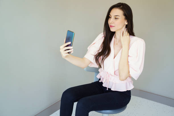 istock Young beautiful woman using smartphone at office 1355489152