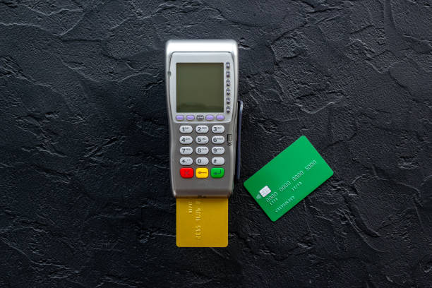 istock Payment on trade through mobile and nfc technology. Pos credit card terminal 1355490269