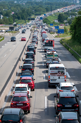 Wiesbaden, Germany - June 16, 2021: High-angle view of a traffic jam on German highway A643 between Wiesbaden and Mainz. A 643 is a short German highway which connects the cities of Wiesbaden (Hesse) and Mainz (Rhineland-Palatinate)